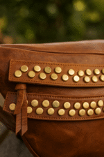 premium studded brown leather belt bag by dario lario – handcrafted crossbody waist package