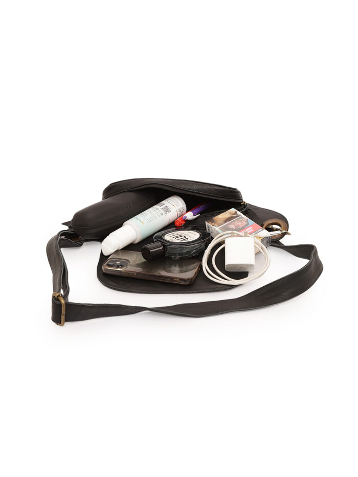 Black leather waist pouch with flap closure and silver rivet detailing Dario Lario saddle style hip bag