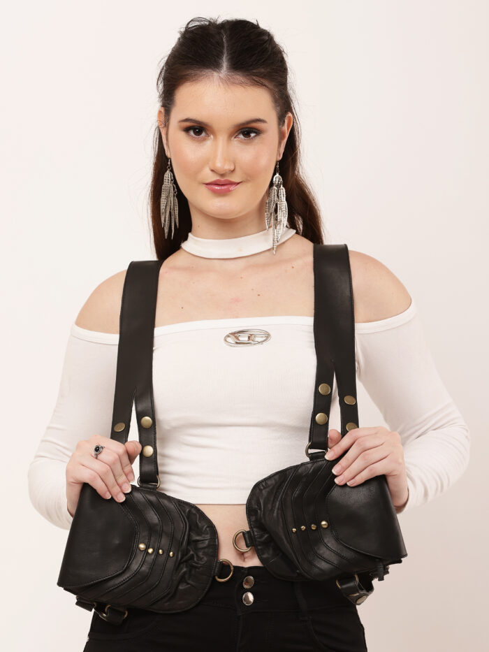 Model wearing black studded double leather holster bag with dual shoulder straps