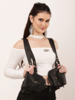 Model wearing black studded double leather holster bag with dual shoulder straps