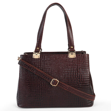 Brown croc-embossed leather handbag with double handles, placed in soft natural light with flowers nearby — a premium, handcrafted accessory by Dario Lario.