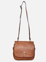 “Tan leather sling bag with gold hardware and front twist-lock closure against a light background.”