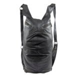 “Black leather travel bag worn over the shoulder by a model, featuring a soft structured design and zip compartments.”