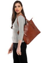 Tan leather tote bag with spacious interior and classic shoulder handles